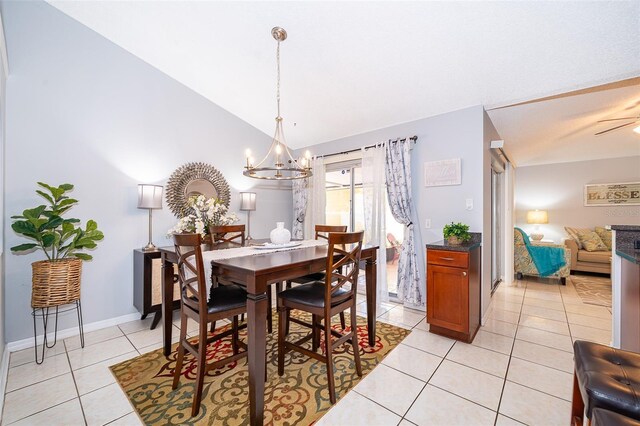 812 Adour Dr, Kissimmee, FL 34759 - dining space featuring light tile patterned floors, a chandelier, and vaulted ceiling