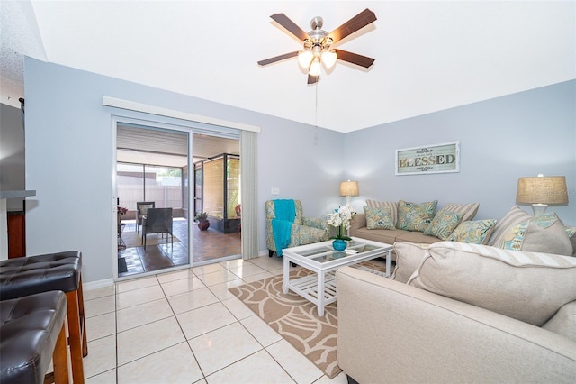 812 Adour Dr, Kissimmee, FL 34759 - living area with a ceiling fan, light tile patterned floors, and vaulted ceiling
