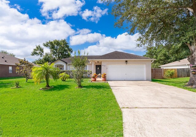 812 Adour Dr, Kissimmee, FL 34759 - single story home with driveway, a garage, and stucco siding