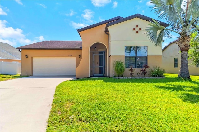 4720 Doral Pointe Dr, Kissimmee, FL 34758 - mediterranean / spanish home featuring a garage, stucco siding, and concrete driveway