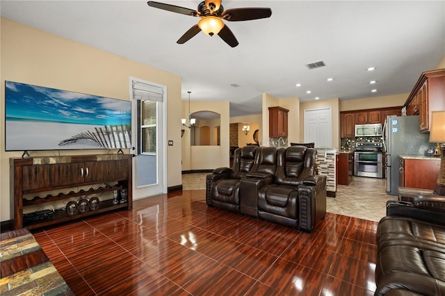 3759 Eagle Isle Cir, Kissimmee, FL 34746 - living area with ceiling fan, arched walkways, baseboards, and recessed lighting