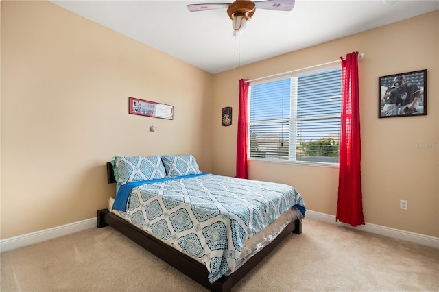3759 Eagle Isle Cir, Kissimmee, FL 34746 - bedroom featuring light carpet, baseboards, and ceiling fan