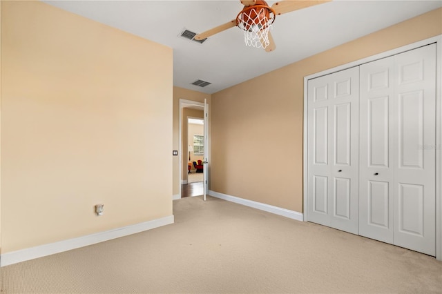 3759 Eagle Isle Cir, Kissimmee, FL 34746 - unfurnished bedroom featuring light carpet, baseboards, a closet, and ceiling fan
