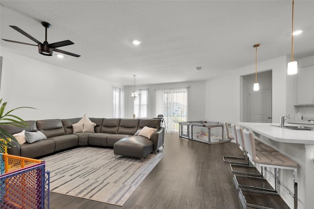 685 Overpool Ave, Davenport, FL 33896 - living room featuring dark wood finished floors, a ceiling fan, recessed lighting, and a textured ceiling