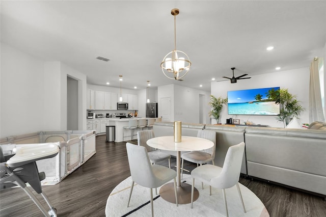685 Overpool Ave, Davenport, FL 33896 - dining area featuring recessed lighting, dark wood finished floors, a chandelier, and a ceiling fan