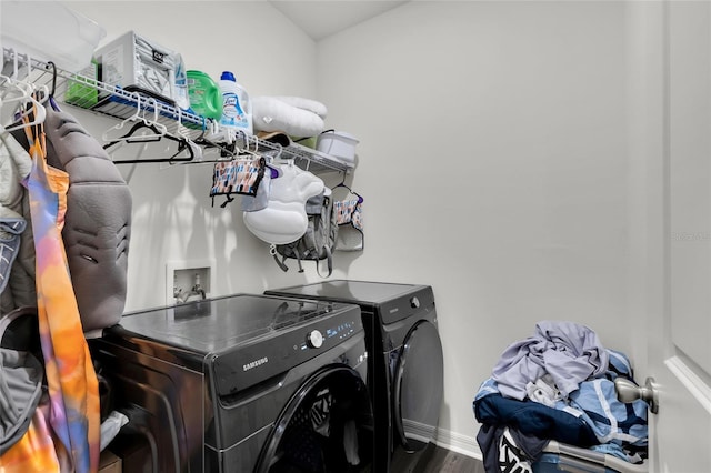 685 Overpool Ave, Davenport, FL 33896 - washroom with washer and clothes dryer and wood finished floors