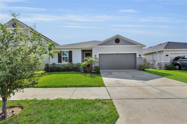 685 Overpool Ave, Davenport, FL 33896 - ranch-style house with an attached garage, driveway, stucco siding, and a front yard