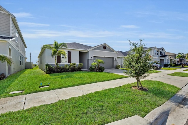 685 Overpool Ave, Davenport, FL 33896 - view of front of home with driveway, a front lawn, a residential view, an attached garage, and stucco siding