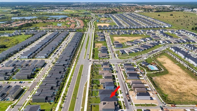 685 Overpool Ave, Davenport, FL 33896 - aerial overview of property's location with a nearby body of water and nearby suburban area