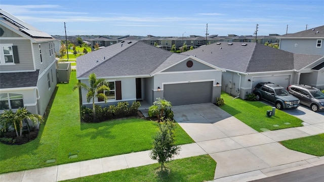 685 Overpool Ave, Davenport, FL 33896 - view of front facade with a residential view, a garage, roof with shingles, and concrete driveway