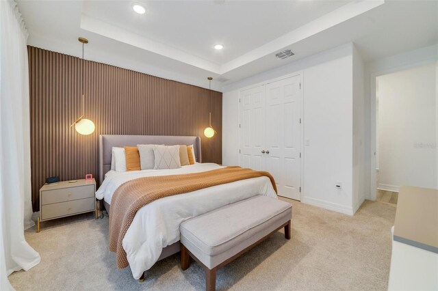 2224 Celebration Blvd, Celebration, FL 34747 - bedroom with light colored carpet, recessed lighting, a closet, a raised ceiling, and baseboards