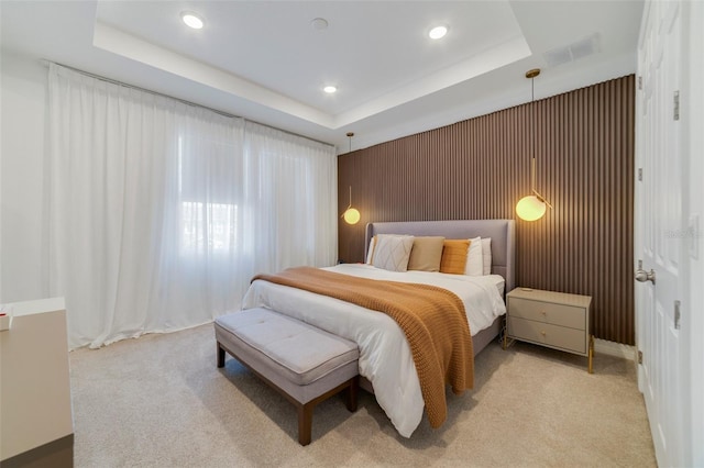 2224 Celebration Blvd, Celebration, FL 34747 - bedroom featuring light carpet, a tray ceiling, and recessed lighting