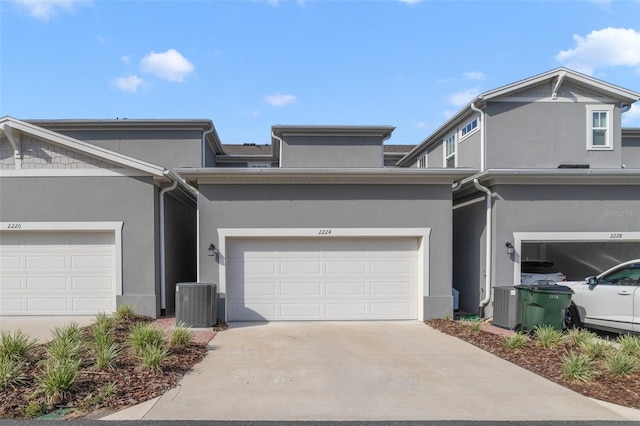 2224 Celebration Blvd, Celebration, FL 34747 - townhome / multi-family property featuring central AC unit, stucco siding, and driveway