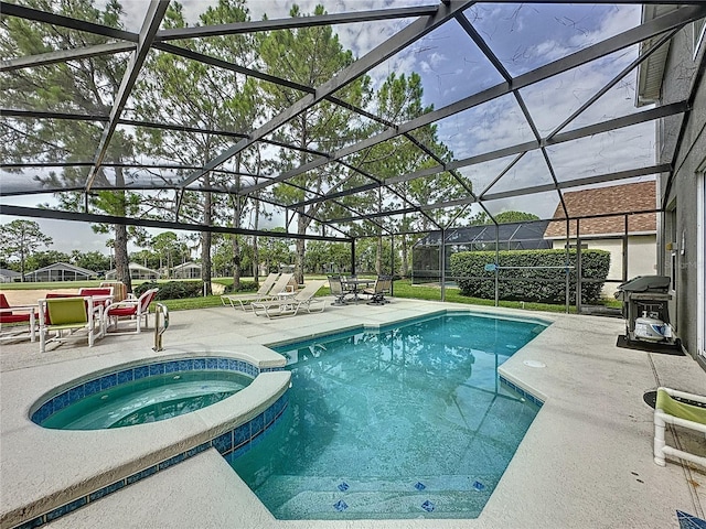 1426 Park Park, Haines City, FL 33844 - view of pool with a patio area, glass enclosure, a pool with connected hot tub, and grilling area