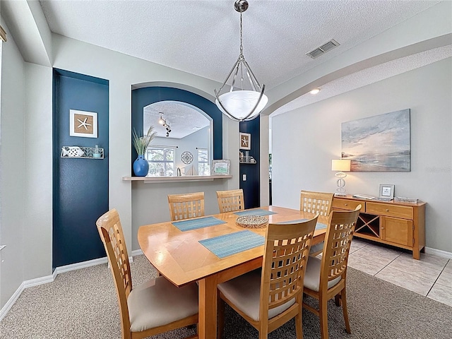 1426 Park Park, Haines City, FL 33844 - dining room with a textured ceiling, light carpet, and light tile patterned floors