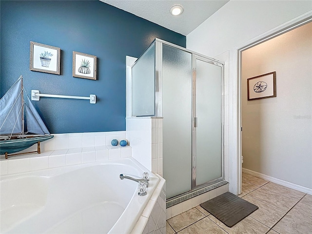 1426 Park Park, Haines City, FL 33844 - bathroom with a stall shower, a bath, and tile patterned floors