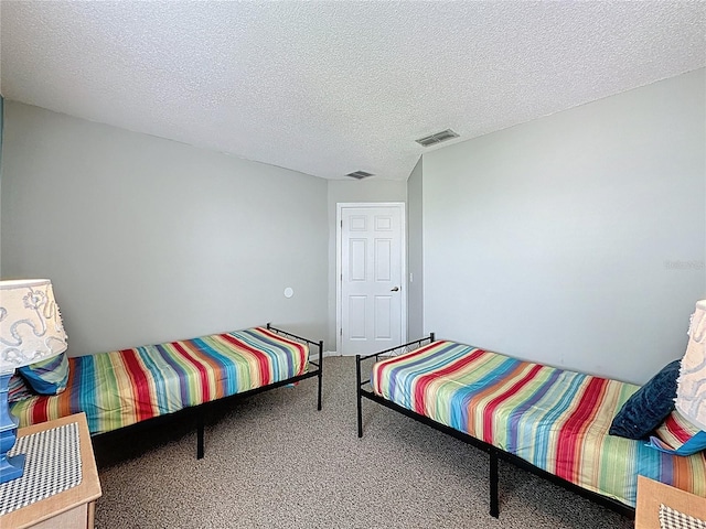 1426 Park Park, Haines City, FL 33844 - bedroom featuring carpet floors and a textured ceiling