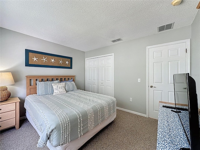 1426 Park Park, Haines City, FL 33844 - carpeted bedroom with a closet and a textured ceiling
