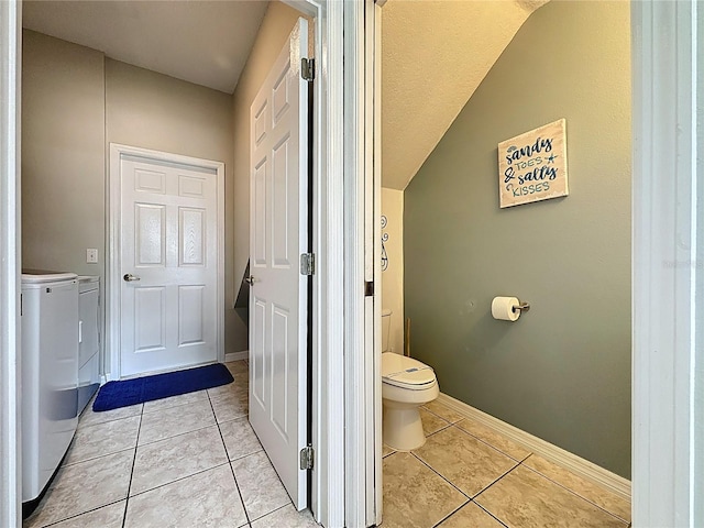 1426 Park Park, Haines City, FL 33844 - bathroom with independent washer and dryer, tile patterned flooring, and lofted ceiling