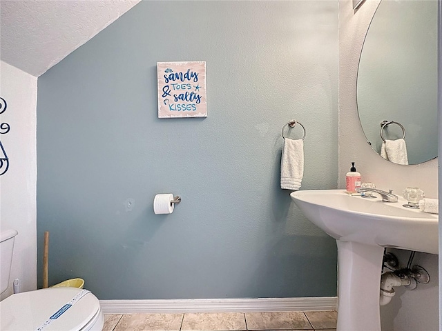 1426 Park Park, Haines City, FL 33844 - half bathroom with lofted ceiling and tile patterned floors
