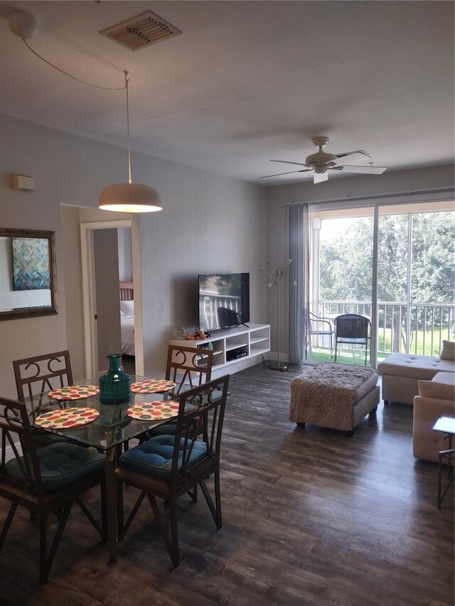 8101 Coconut Palm Way Unit 303, Kissimmee, FL 34747 - dining area with dark wood-style floors and a ceiling fan
