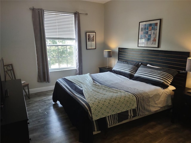 8101 Coconut Palm Way Unit 303, Kissimmee, FL 34747 - bedroom featuring wood finished floors and baseboards