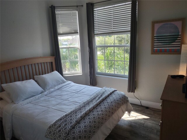 8101 Coconut Palm Way Unit 303, Kissimmee, FL 34747 - bedroom with wood finished floors and baseboards
