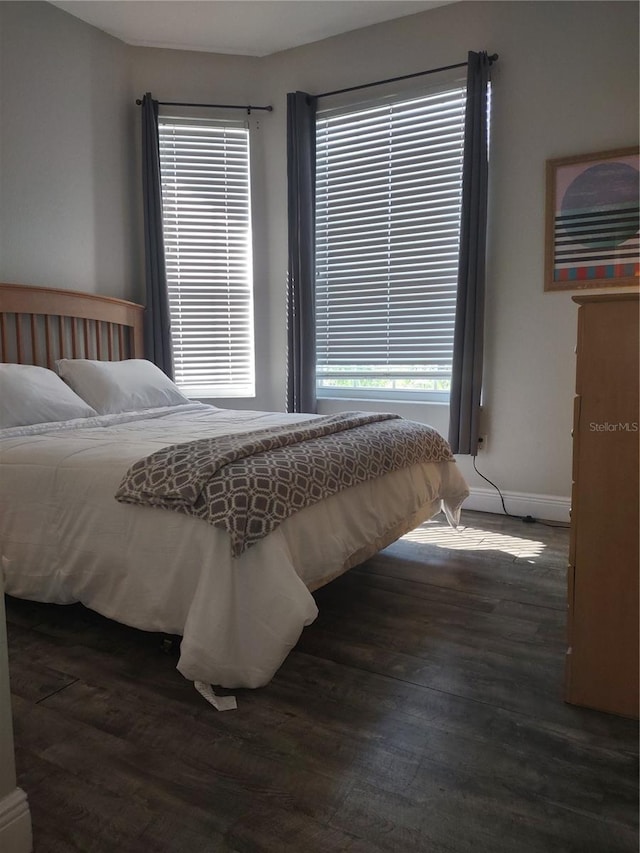 8101 Coconut Palm Way Unit 303, Kissimmee, FL 34747 - bedroom featuring wood finished floors and baseboards