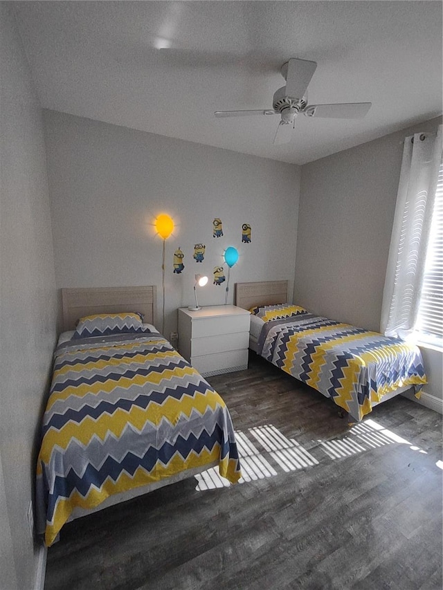 8101 Coconut Palm Way Unit 303, Kissimmee, FL 34747 - bedroom featuring wood finished floors and a ceiling fan