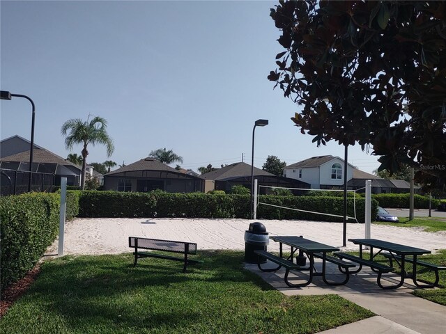 8101 Coconut Palm Way Unit 303, Kissimmee, FL 34747 - surrounding community featuring volleyball court and a lawn