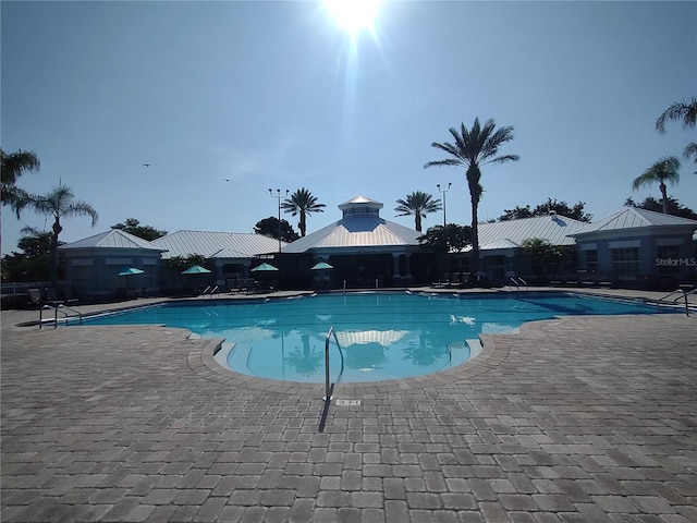 8101 Coconut Palm Way Unit 303, Kissimmee, FL 34747 - community pool with a gazebo and a patio
