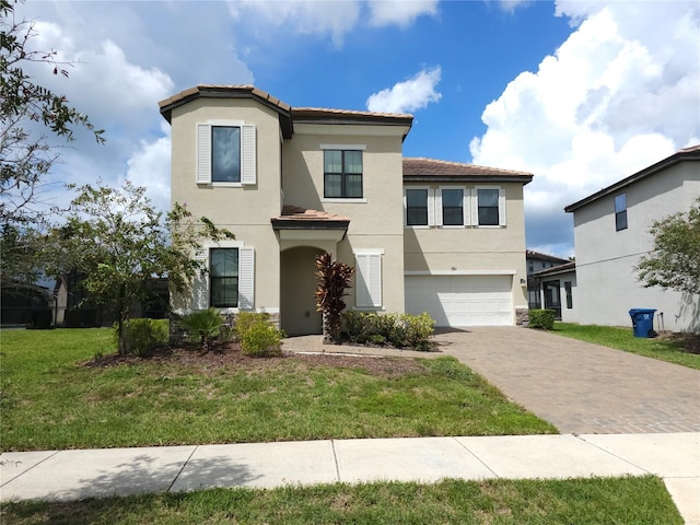 191 Aidans Lndg, Haines City, FL 33844 - view of front of home with stucco siding, a garage, decorative driveway, and a front lawn