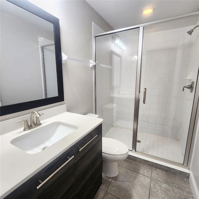 191 Aidans Lndg, Haines City, FL 33844 - bathroom with vanity, toilet, a stall shower, tile patterned flooring, and a textured ceiling