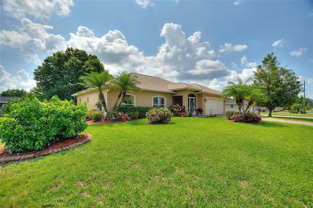 4236 Lakewood Rd, Sebring, FL 33875 - mediterranean / spanish-style house featuring an attached garage, stucco siding, a front lawn, and driveway