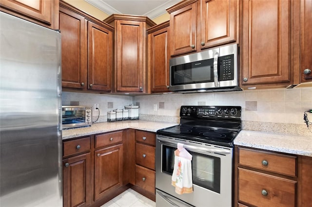 4236 Lakewood Rd, Sebring, FL 33875 - kitchen with appliances with stainless steel finishes, light stone countertops, backsplash, ornamental molding, and brown cabinets