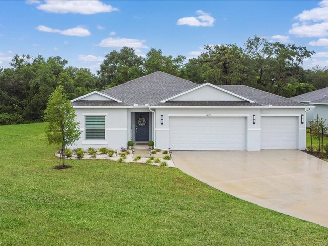 1278 Asher Mason Ave, Kissimmee, FL 34744 - single story home featuring stucco siding, roof with shingles, an attached garage, a front lawn, and driveway