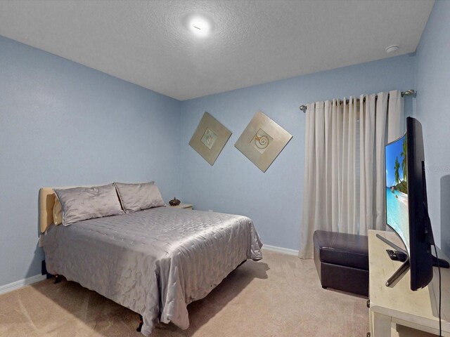 1278 Asher Mason Ave, Kissimmee, FL 34744 - bedroom with carpet, baseboards, and a textured ceiling