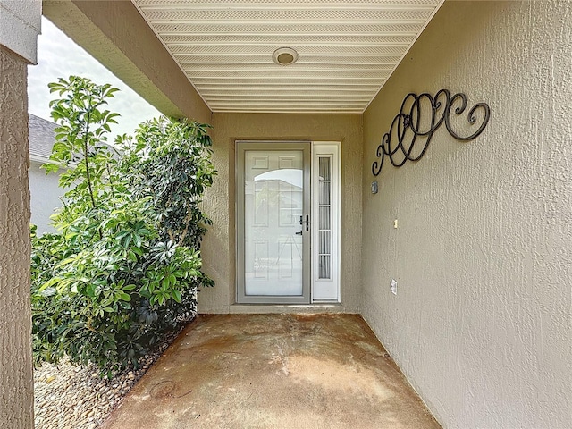 1428 Park Pl, Haines City, FL 33844 - property entrance featuring stucco siding