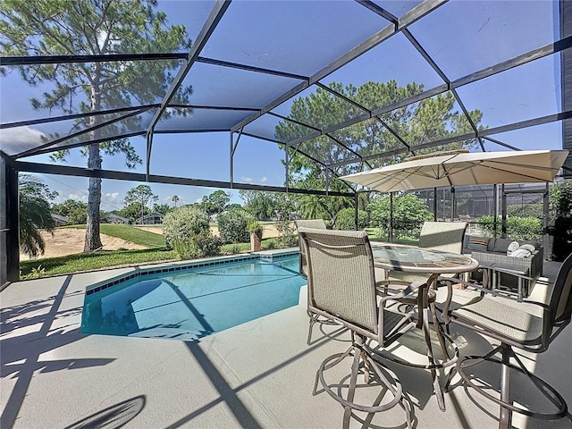1428 Park Pl, Haines City, FL 33844 - outdoor pool featuring a patio area and glass enclosure