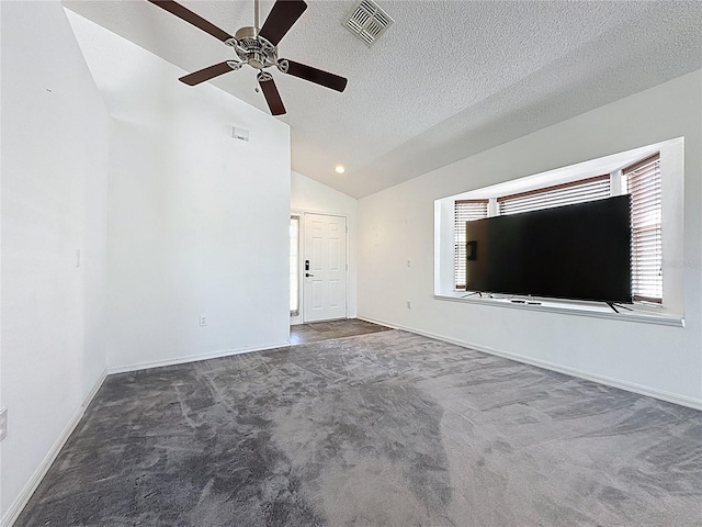 1428 Park Pl, Haines City, FL 33844 - unfurnished living room with lofted ceiling, carpet floors, a ceiling fan, healthy amount of natural light, and a textured ceiling