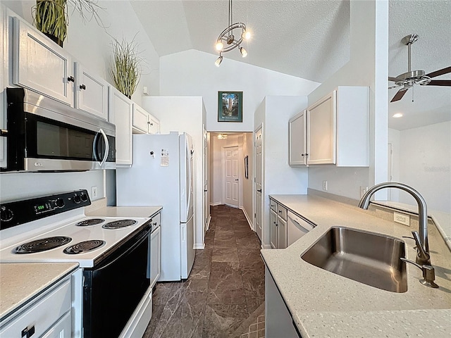 1428 Park Pl, Haines City, FL 33844 - kitchen featuring stainless steel microwave, electric range, light countertops, a ceiling fan, and dishwasher