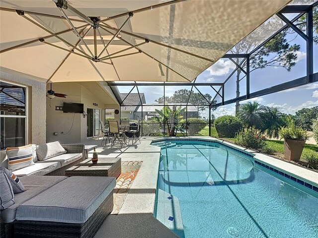 1428 Park Pl, Haines City, FL 33844 - swimming pool featuring a patio, an outdoor hangout area, a lanai, outdoor dining area, and ceiling fan