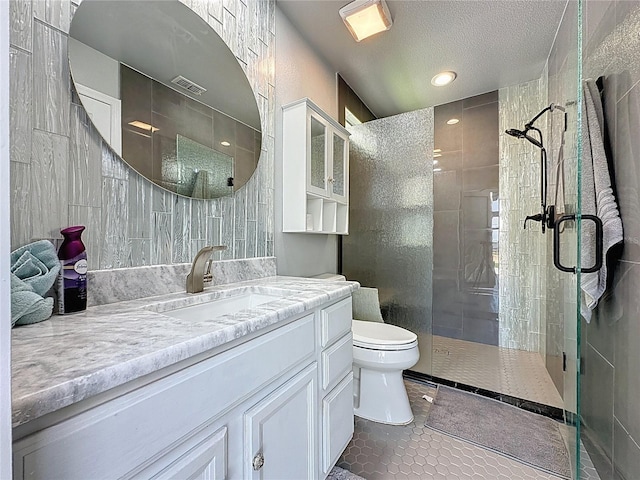 1428 Park Pl, Haines City, FL 33844 - full bath with a shower stall, vanity, tile patterned flooring, and a textured ceiling