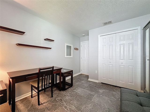 1428 Park Pl, Haines City, FL 33844 - home office featuring baseboards and a textured ceiling