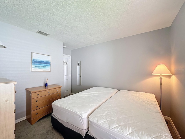 1428 Park Pl, Haines City, FL 33844 - bedroom featuring carpet floors and a textured ceiling