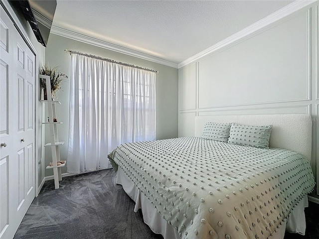 1428 Park Pl, Haines City, FL 33844 - bedroom with ornamental molding, dark colored carpet, and a closet