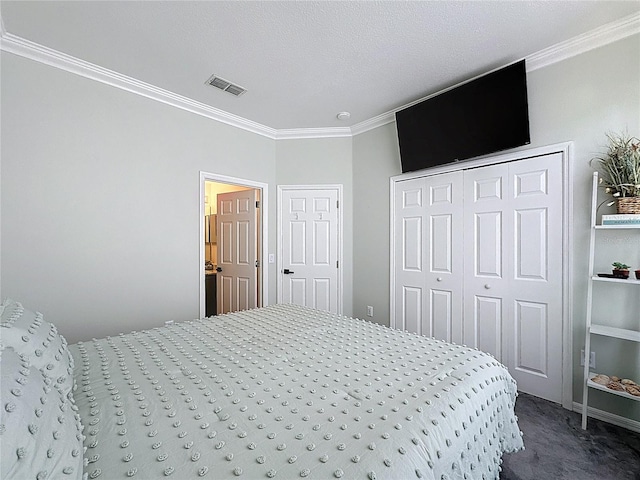 1428 Park Pl, Haines City, FL 33844 - bedroom with crown molding, dark colored carpet, and a closet