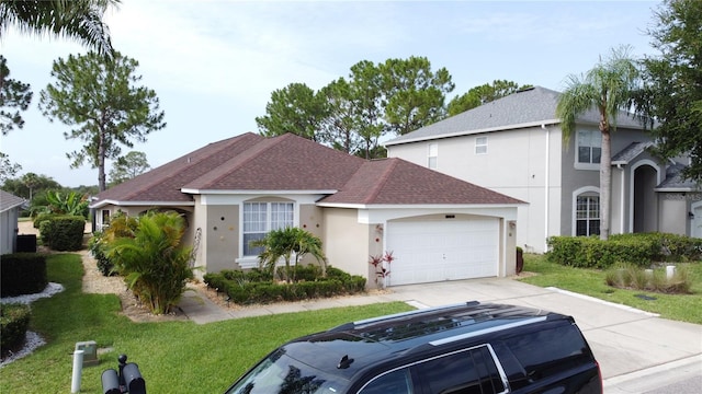 1428 Park Pl, Haines City, FL 33844 - view of front of property with stucco siding, concrete driveway, an attached garage, a front yard, and a shingled roof