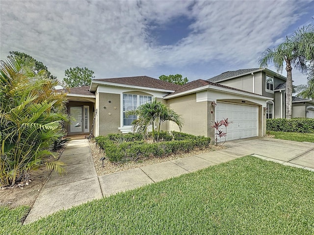 1428 Park Pl, Haines City, FL 33844 - view of front of property with stucco siding, driveway, an attached garage, and a front yard