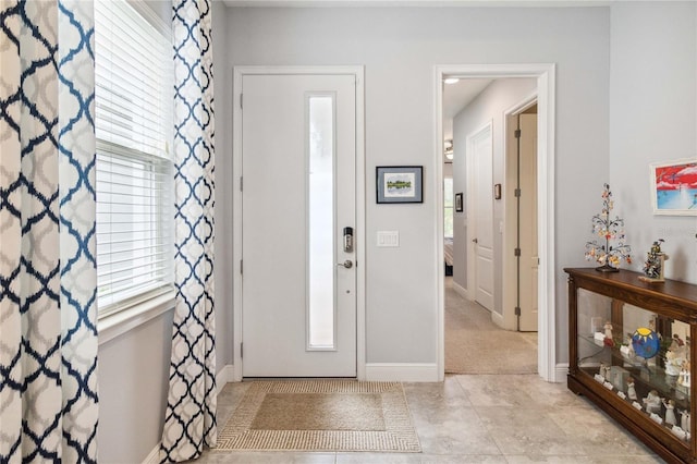 5025 Sunfalls Ave, Saint Cloud, FL 34772 - tiled foyer featuring healthy amount of natural light and baseboards